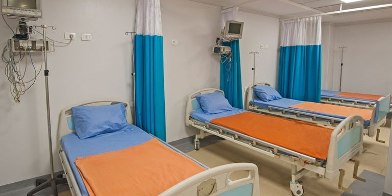 Hospital beds in a private hospital intensive care ward with monitoring equipment